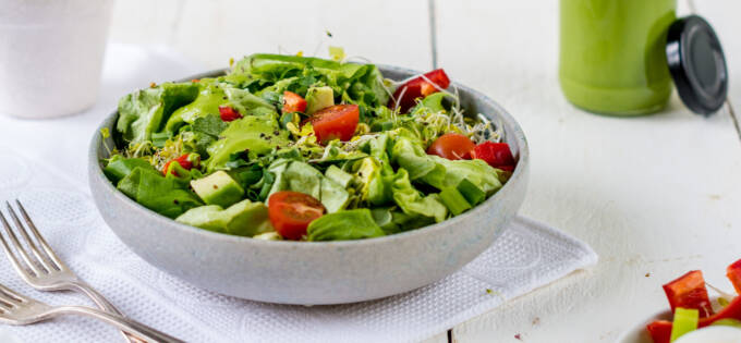 Salad with green avocado dressing